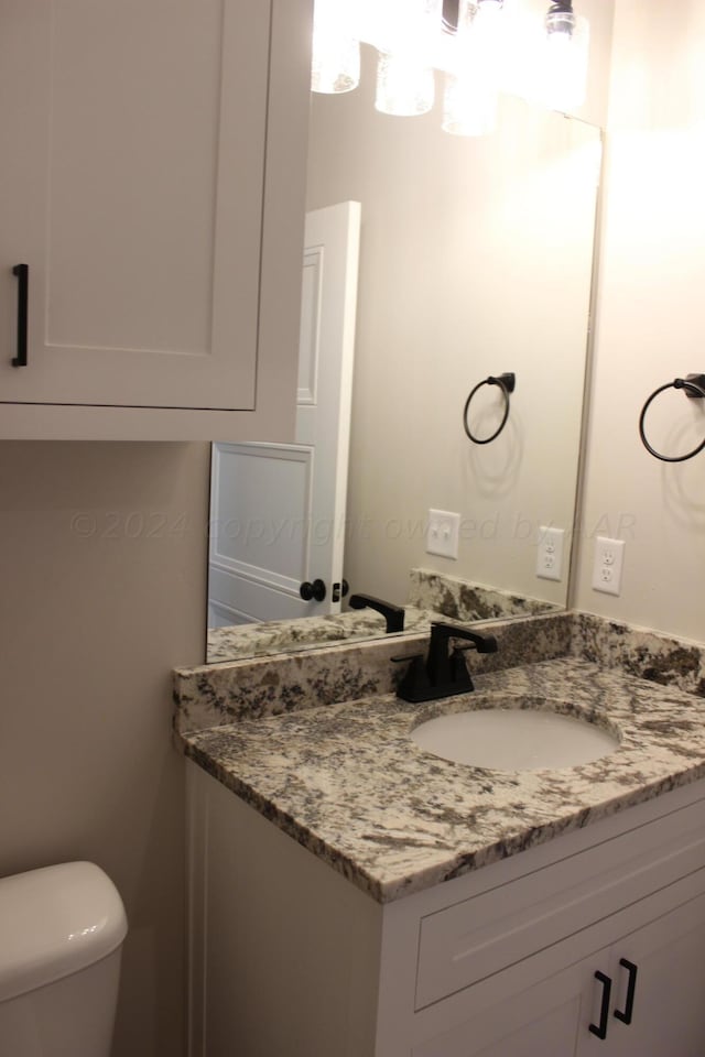 8104 Miami Ave, Amarillo, TX 79118 - half bath featuring vanity and toilet
