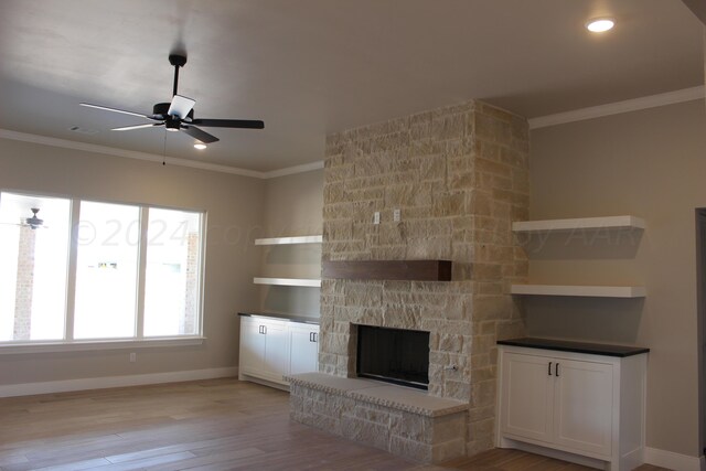 8104 Miami Ave, Amarillo, TX 79118 - unfurnished living room with ceiling fan, baseboards, crown molding, light wood-style floors, and a fireplace
