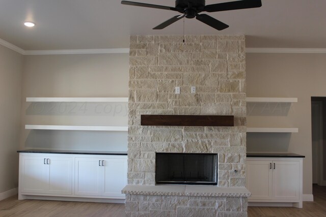 8104 Miami Ave, Amarillo, TX 79118 - unfurnished living room featuring ornamental molding, a ceiling fan, light wood-style floors, baseboards, and a fireplace
