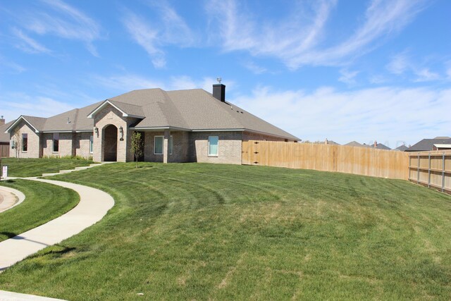 8104 Miami Ave, Amarillo, TX 79118 - view of front of house with brick siding and a chimney
