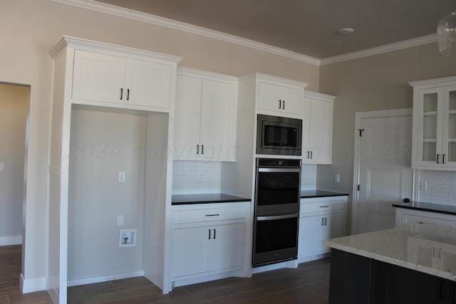 8104 Miami Ave, Amarillo, TX 79118 - kitchen featuring stainless steel appliances, backsplash, dark wood-type flooring, white cabinetry, and ornamental molding