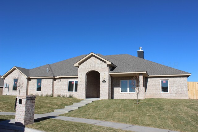 8104 Miami Ave, Amarillo, TX 79118 - french country inspired facade with brick siding, a chimney, and a shingled roof