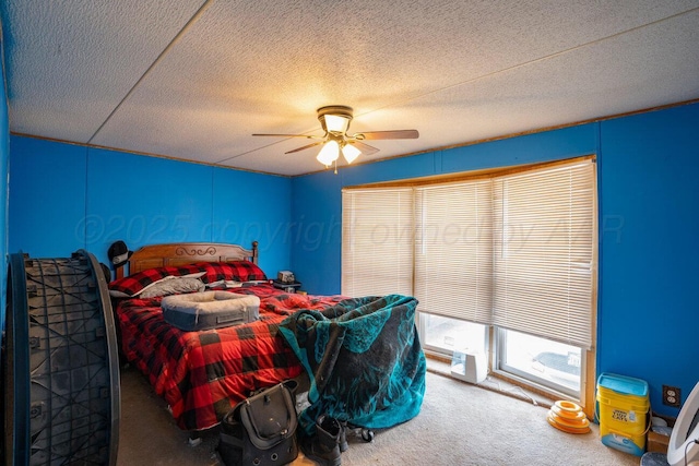 carpeted bedroom featuring a textured ceiling and a ceiling fan