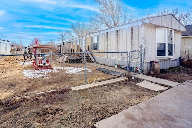 view of side of home with fence