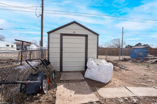 view of shed with a fenced backyard