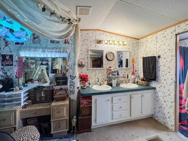 full bath featuring lofted ceiling, wallpapered walls, double vanity, and a sink