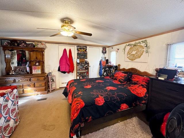 carpeted bedroom with visible vents, ceiling fan, vaulted ceiling, crown molding, and a textured ceiling