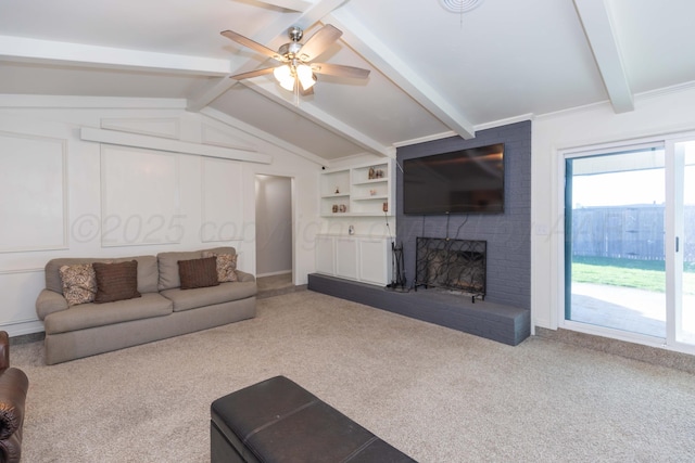 carpeted living room with a ceiling fan and a brick fireplace