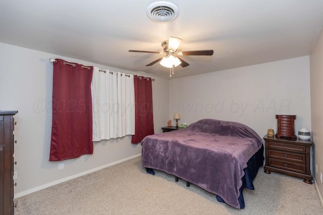 carpeted bedroom with baseboards and a ceiling fan