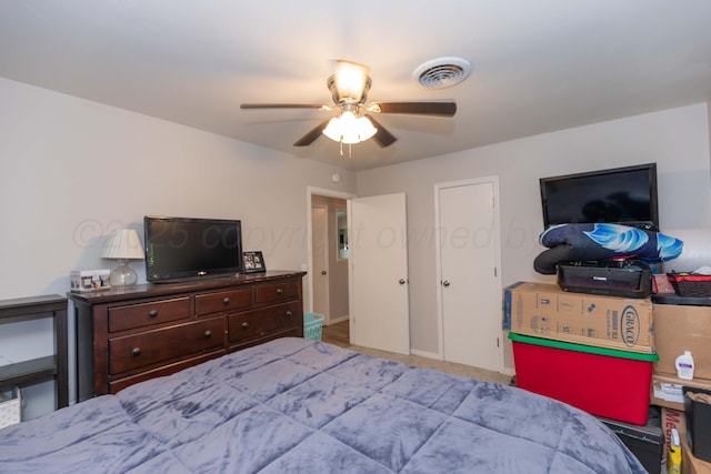 bedroom featuring a ceiling fan, carpet, and baseboards