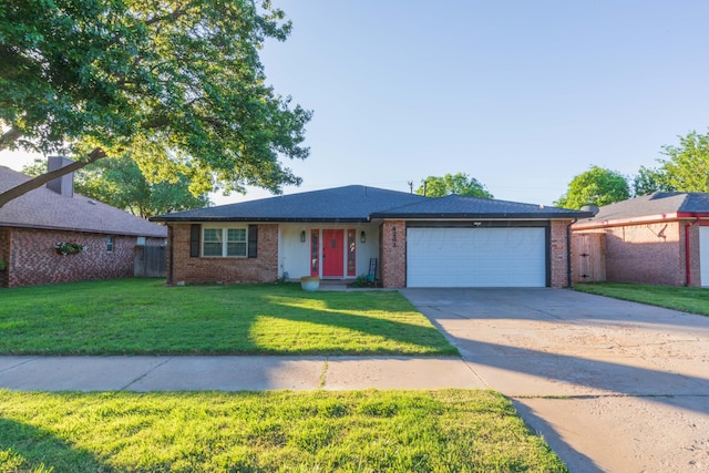 ranch-style home featuring a garage, driveway, and brick siding