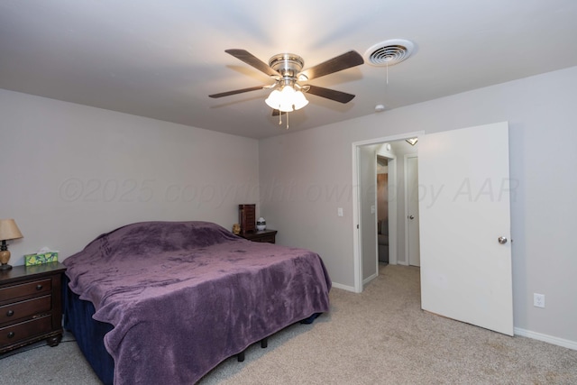 bedroom with light carpet, baseboards, and a ceiling fan