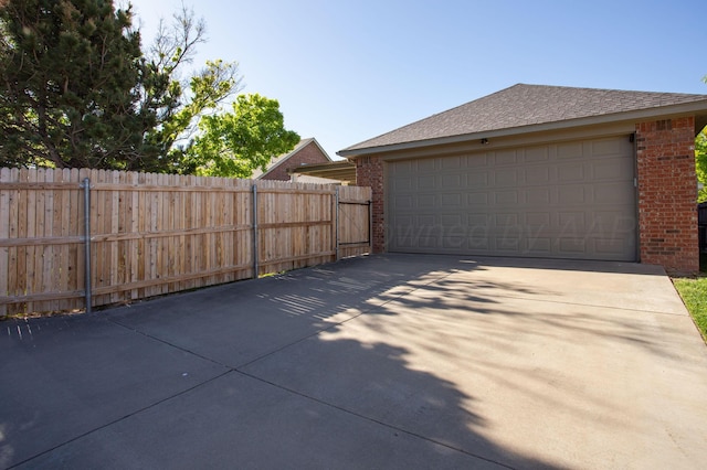 garage with fence