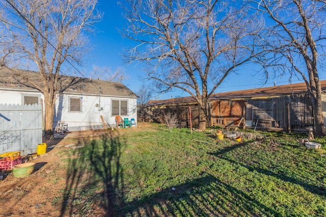 view of yard with a fenced backyard