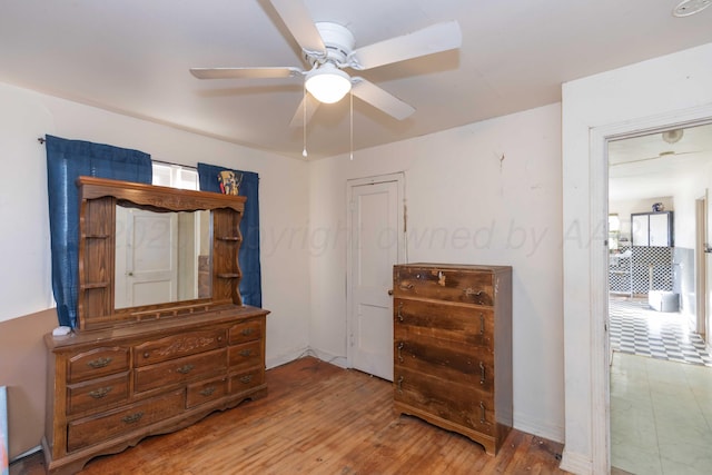 bedroom with ceiling fan and wood finished floors