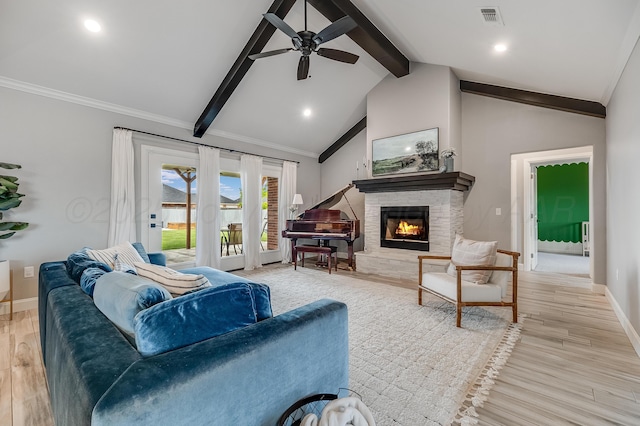 1600 NE 6th St, Dumas, TX 79029 - living area featuring ceiling fan, a stone fireplace, visible vents, light wood-type flooring, and baseboards