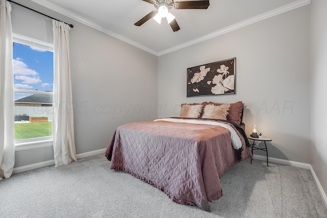 1600 NE 6th St, Dumas, TX 79029 - bedroom with baseboards, ornamental molding, carpet, and a ceiling fan