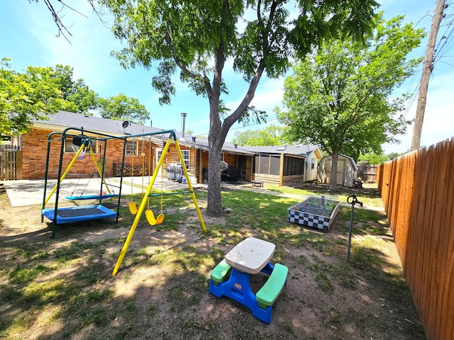 522 N Red Deer St, Pampa, TX 79065 - fenced backyard featuring a playground and a sunroom