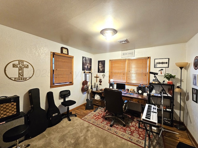 522 N Red Deer St, Pampa, TX 79065 - office space with baseboards, wood finished floors, and a textured wall