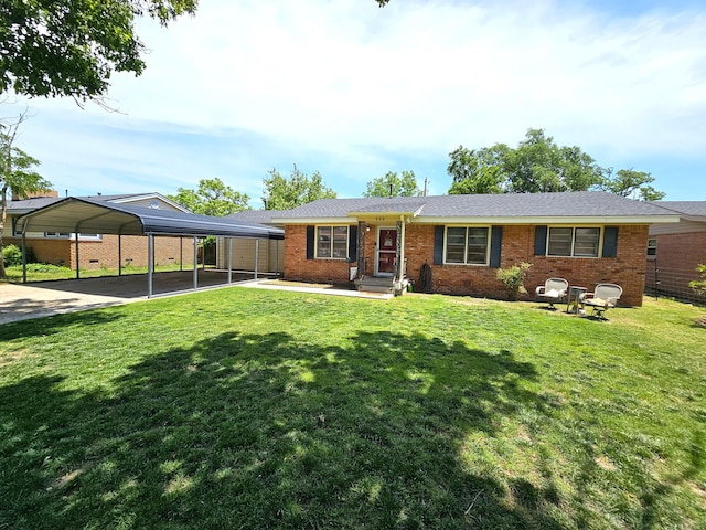 522 N Red Deer St, Pampa, TX 79065 - ranch-style home featuring a detached carport, brick siding, a front lawn, and concrete driveway