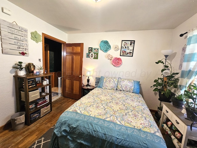522 N Red Deer St, Pampa, TX 79065 - bedroom featuring dark wood-style flooring