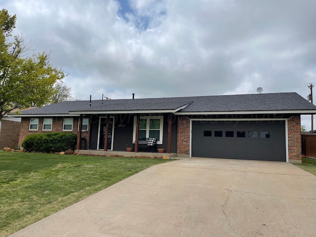 1711 N Holly Ln, Pampa, TX 79065 - ranch-style house with an attached garage, a front lawn, concrete driveway, brick siding, and a porch
