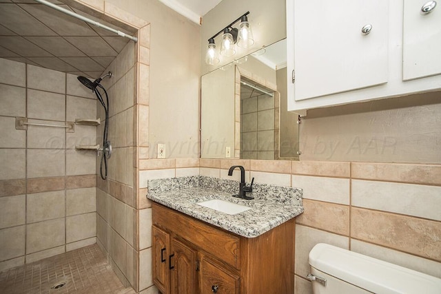 3122 Nebraska St, Amarillo, TX 79106 - full bathroom featuring tiled shower, vanity, and tile walls