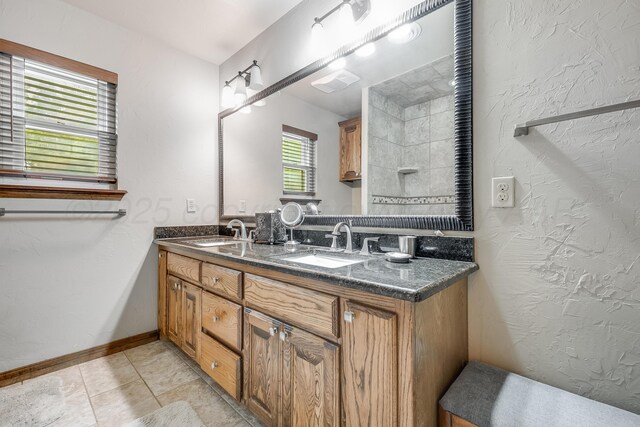300 W 11th St, Wheeler, TX 79096 - full bathroom with double vanity and tile patterned flooring