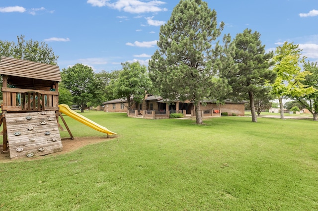 300 W 11th St, Wheeler, TX 79096 - view of grassy yard with a playground