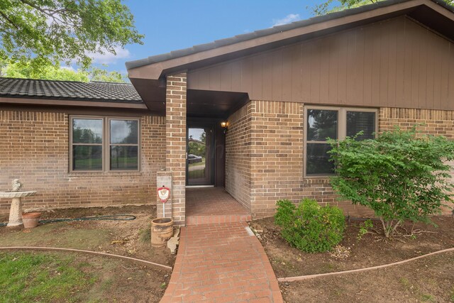 300 W 11th St, Wheeler, TX 79096 - property entrance featuring brick siding
