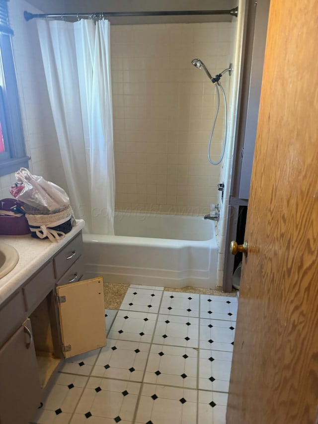 bathroom featuring tile patterned floors, shower / tub combo with curtain, and vanity