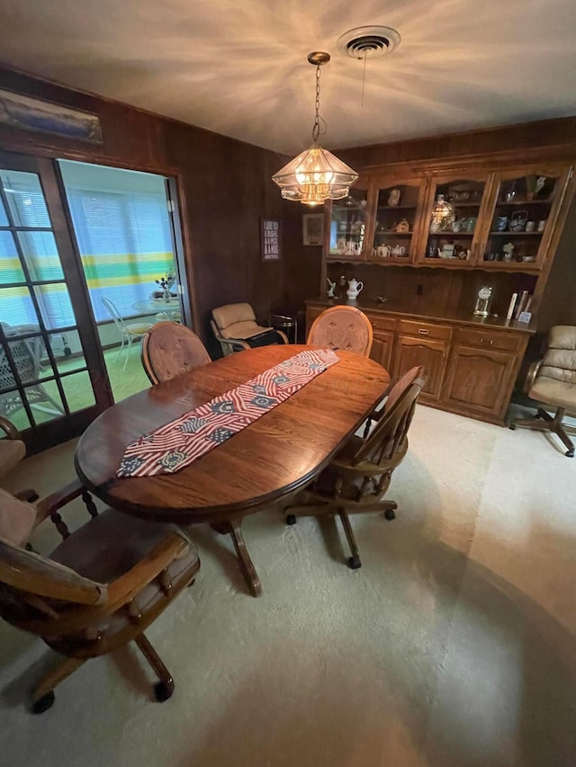 dining space with a notable chandelier