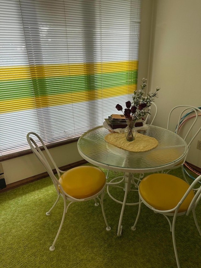 dining space featuring carpet flooring