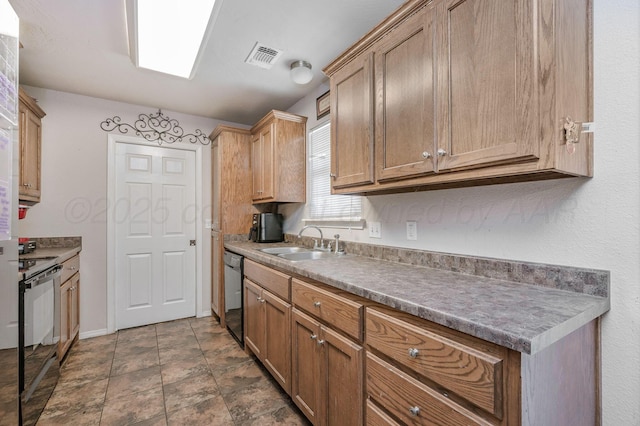 7209 Explorer Trl, Amarillo, TX 79118 - kitchen with black appliances, a sink, baseboards, and dark stone finish floors