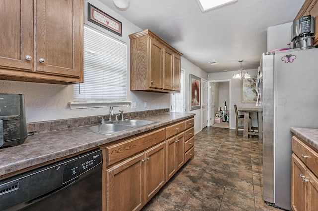 7209 Explorer Trl, Amarillo, TX 79118 - kitchen featuring black dishwasher, freestanding refrigerator, a sink, and brown cabinets