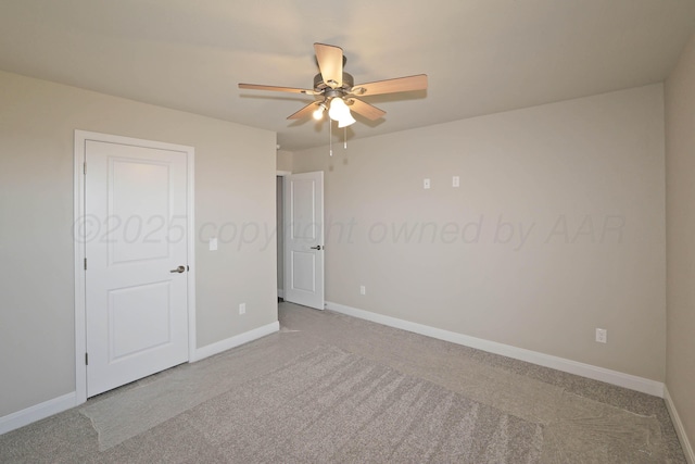 unfurnished bedroom featuring carpet floors, baseboards, and ceiling fan