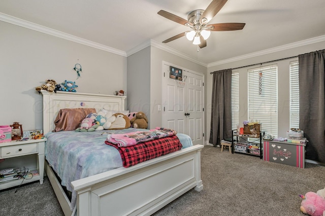 bedroom with ceiling fan, ornamental molding, a closet, and carpet