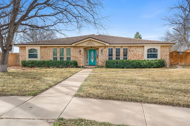 ranch-style house with a front lawn