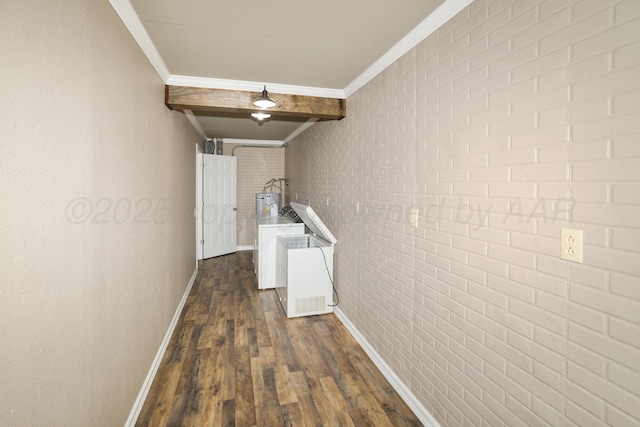 hall with beam ceiling, crown molding, dark hardwood / wood-style floors, and brick wall