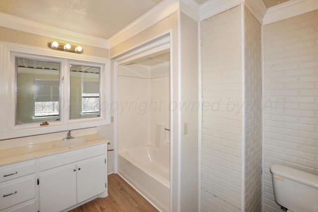 full bathroom featuring ornamental molding, vanity, toilet, and hardwood / wood-style floors