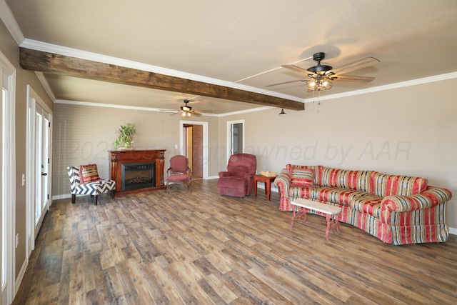 living room featuring hardwood / wood-style flooring, ornamental molding, and beamed ceiling