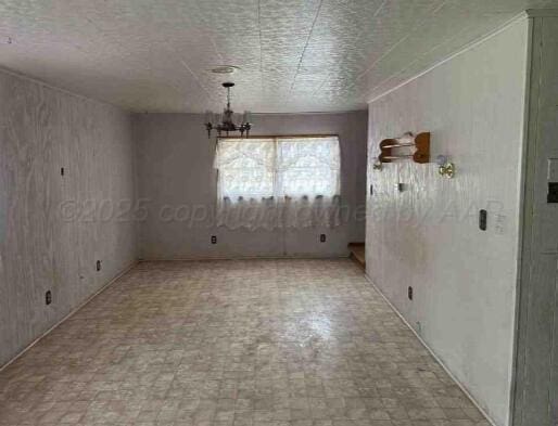 1035 N Duncan St, Pampa, TX 79065 - unfurnished dining area featuring a chandelier