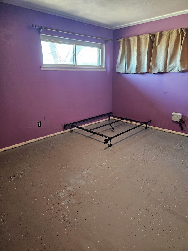 spare room featuring speckled floor