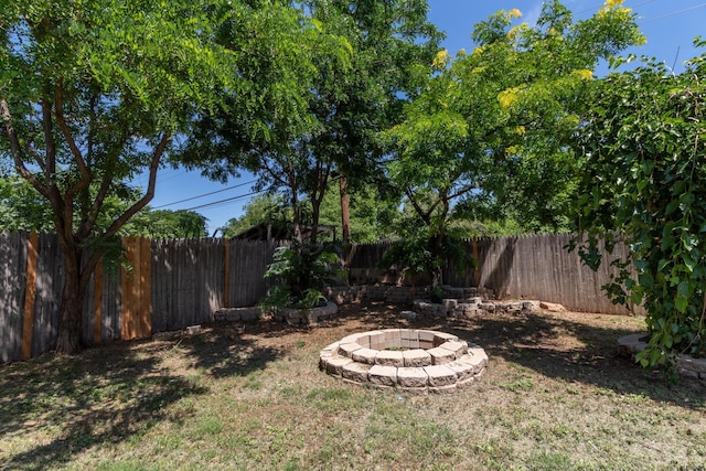 4808 SW 57th Ave, Amarillo, TX 79109 - fenced backyard with a fire pit