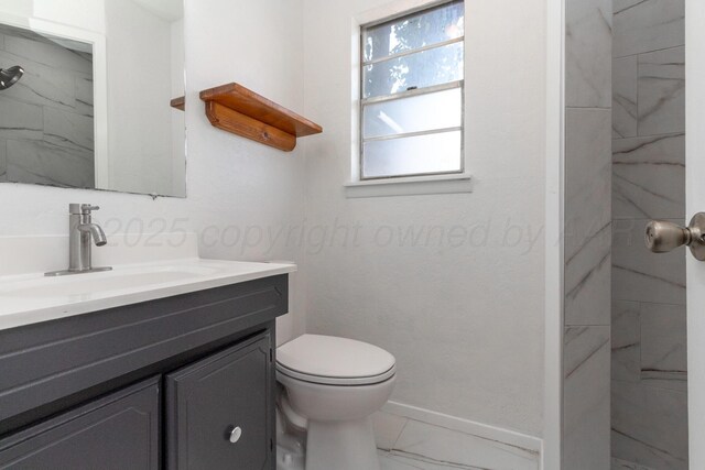 4808 SW 57th Ave, Amarillo, TX 79109 - bathroom featuring marble finish floors, vanity, and a marble finish shower