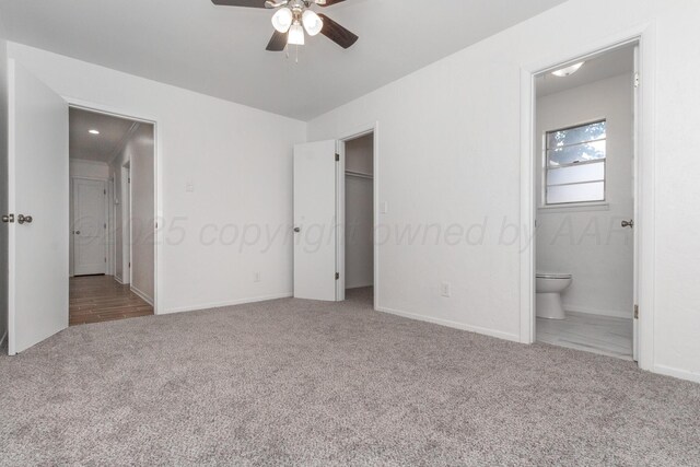 4808 SW 57th Ave, Amarillo, TX 79109 - unfurnished bedroom featuring carpet floors, a spacious closet, connected bathroom, and ceiling fan