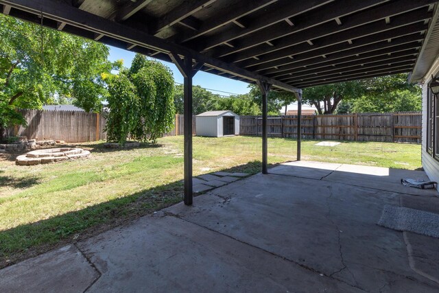 4808 SW 57th Ave, Amarillo, TX 79109 - fenced backyard with a patio and a storage shed