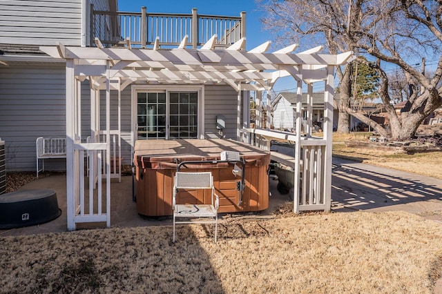 view of patio featuring a hot tub and a pergola