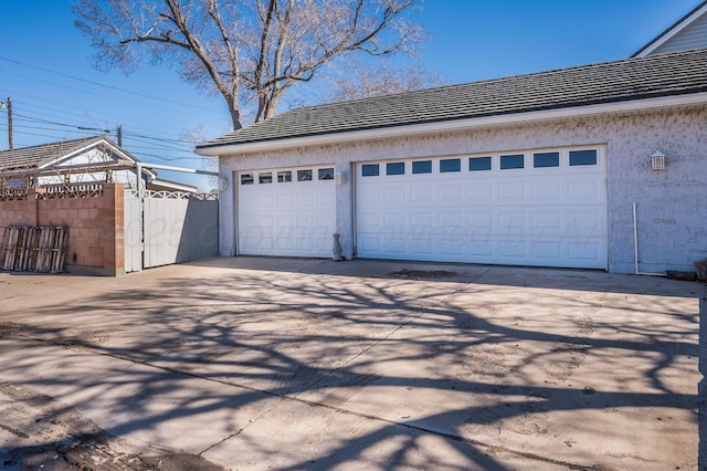 garage featuring fence