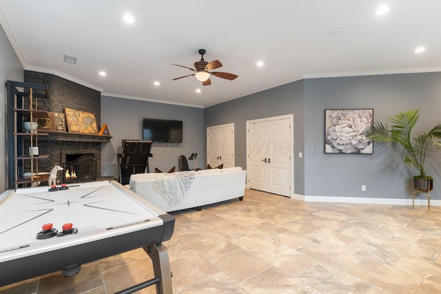 27 Carnoustie Ln, Amarillo, TX 79124 - playroom with ceiling fan, recessed lighting, light stone finish floors, ornamental molding, and a stone fireplace